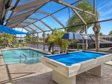 Waterfront Pet Friendly Villa with Heated Pool & Pool Table Nautical Breeze Roelens Vacations